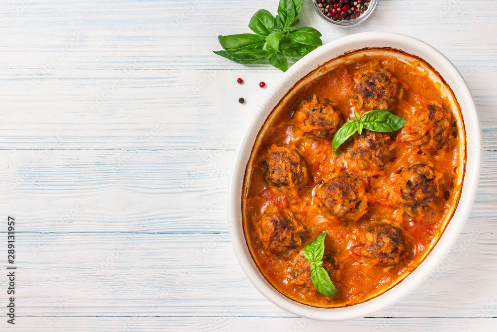 Oven baked meatballs on rustic wooden background. Top view, space for text. Oven baked meatballs on rustic wooden background. Top view, space for text.
