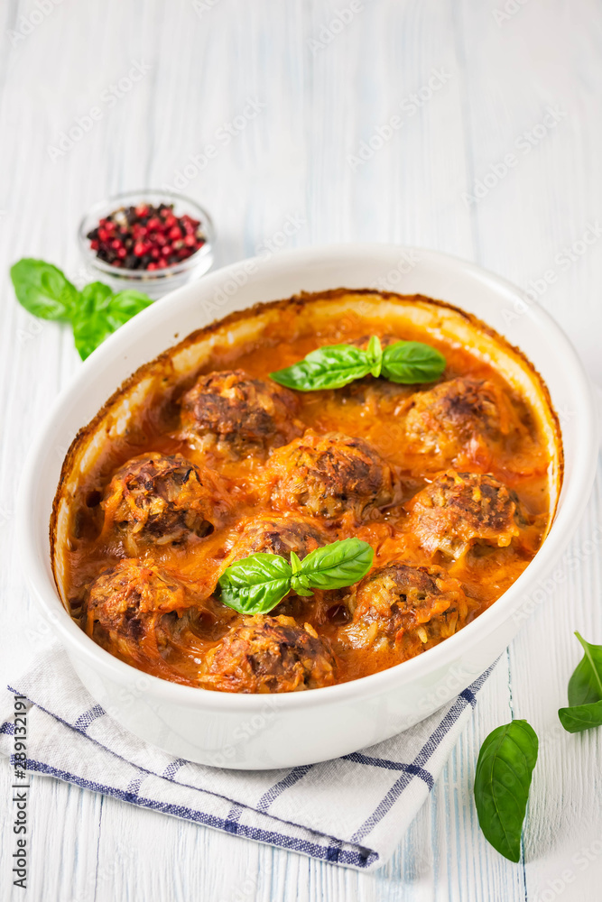 Turkey meatballs in a baking dish. Selective focus, space for text. Turkey meatballs in a baking dish. Selective focus, space for text.