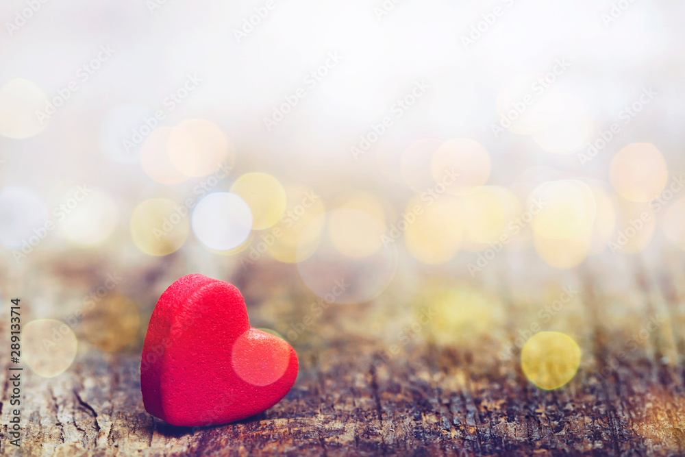 Red heart on wooden background with bokeh light effected, copy space Red heart on wooden background with bokeh light effected, copy space