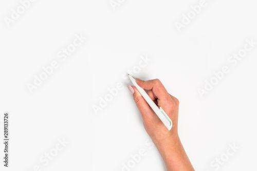 Female hand is ready for drawing with pen on white background