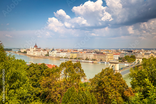 Budapest, panoramic view of The Hungarian Parliament Building, historic buildings and the Chain Bridge over Danube river.
