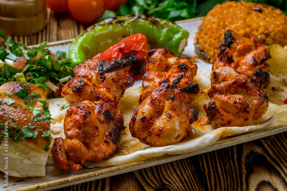 chicken kebab Turkish cuisine on wooden table chicken kebab Turkish cuisine on wooden table