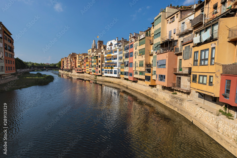 River houses colourful facades on a urban cityscape in Girona, Catalonia