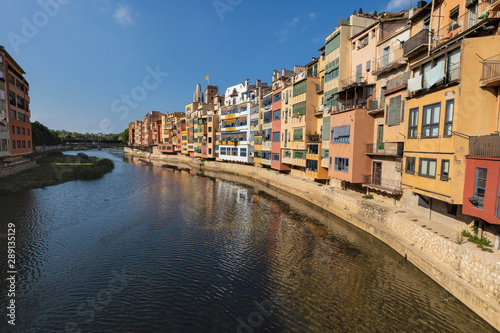 River houses colourful facades on a urban cityscape in Girona, Catalonia