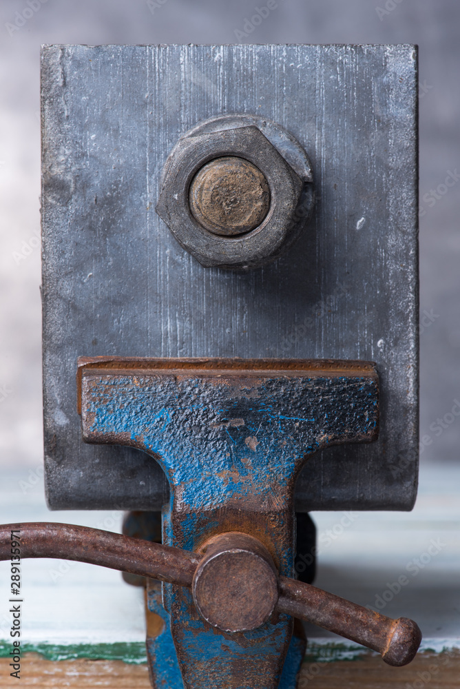 Bench vise with steel element bolt and nut close-up Bench vise with steel element bolt and nut close-up