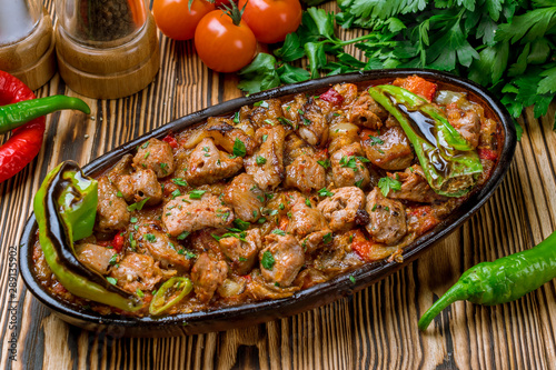 skewers of chop shish Turkish cuisine on wooden table