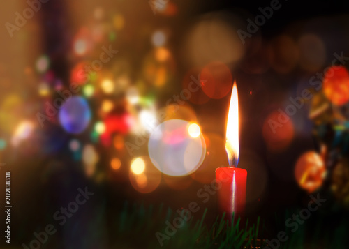Fotografie Four Red Candle on the table in Christmas night with bokeh light effected