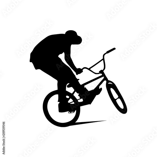 Abstract silhouette of a bmx rider on the white background from particles