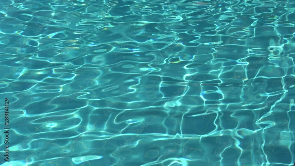 Water ripples on blue tiled swimming pool background. Blue turquoise ...