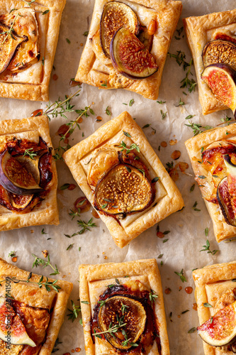 fig puff pastry tarts with cheese, nuts and thyme. top view