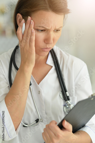 Portrait of a female sad doctor posing in hospital