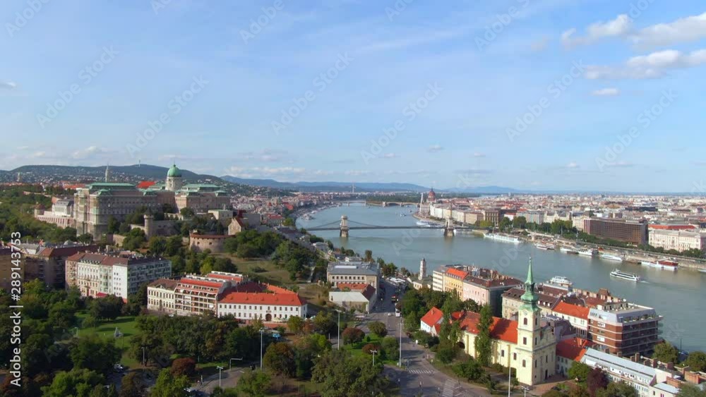 Budapest, Hungary, aerial tilt up shot of Budapest cityscape showing Castle Hill and the Danube river during daytime. Budapest, Hungary, aerial tilt up shot of Budapest cityscape showing Castle Hill and the Danube river during daytime.