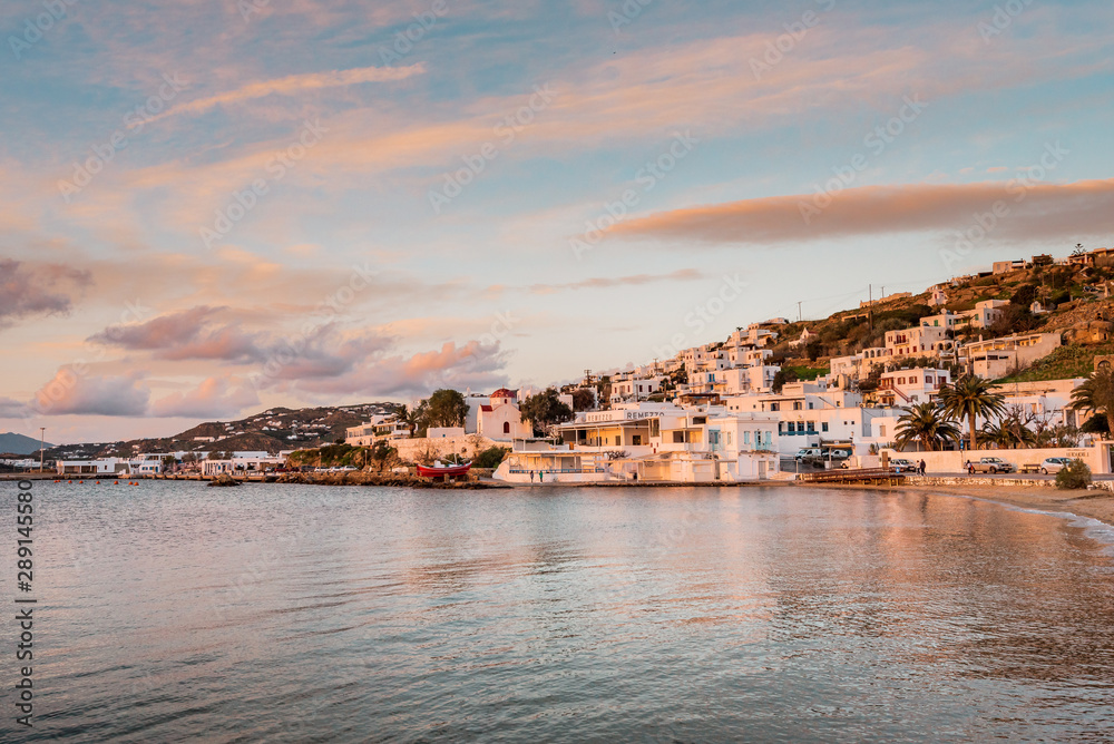 Chora Mykonos, Mykonos/ Greece - 01 22 2019 - Sunset on the famous Cycladic island with romantic evening mood by the sea and view from little venice with fishing boats and white villas for holidays