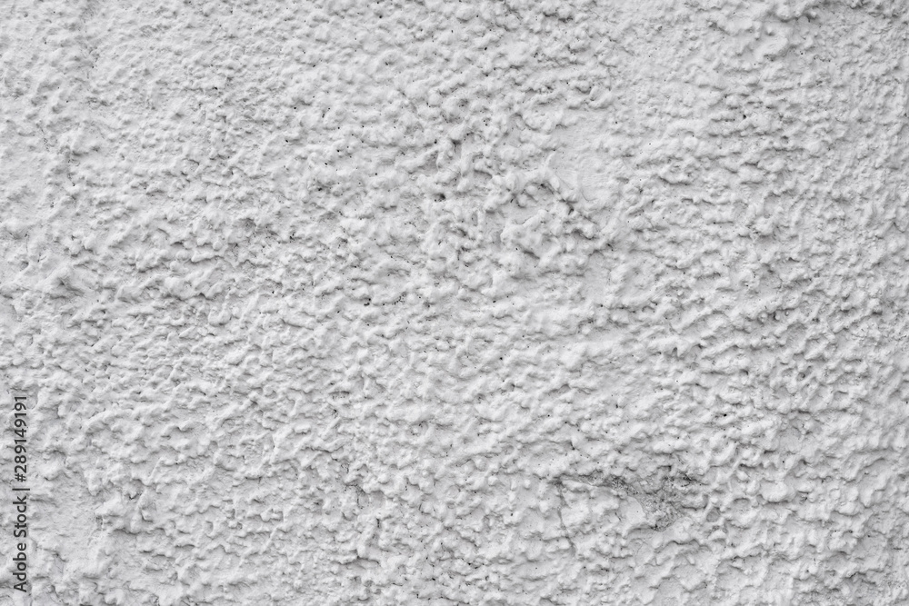 Gray stucco on wall of house. Construction industry. Gray stucco on wall of house. Construction industry.