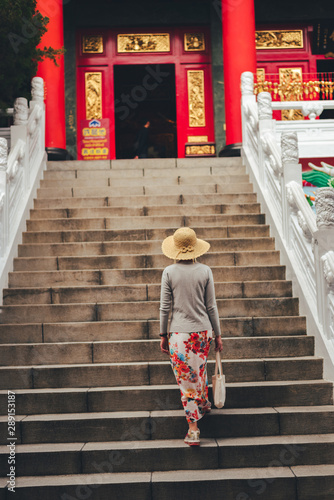 traveling woman walk to a temple