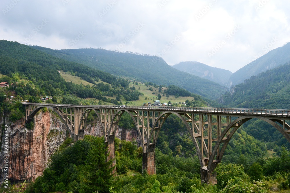 a large bridge between the hills a large bridge between the hills
