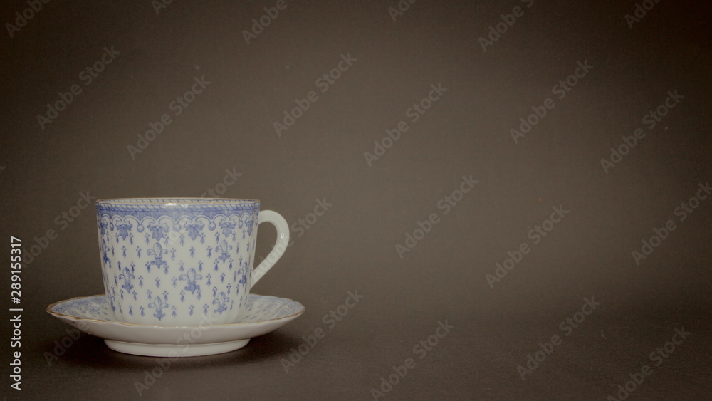 Fototapeta premium A Porcelain cup with black background an copy space