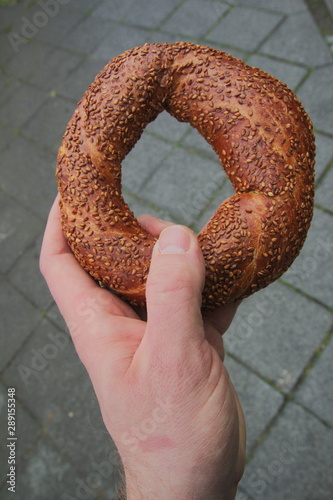 a turkish bagel called simit in my hand