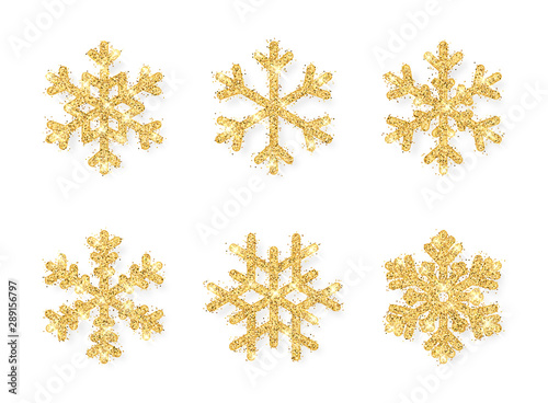 Shining gold snowflakes on white background. Christmas and New Year background. Vector illustration