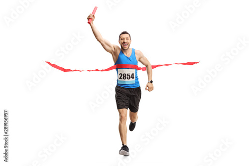 Man finishing a relay race with a baton in his hand