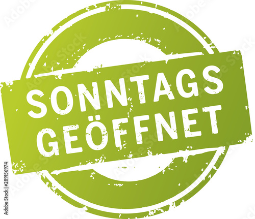 grüner Button Sonntags geöffnet zerkratzt