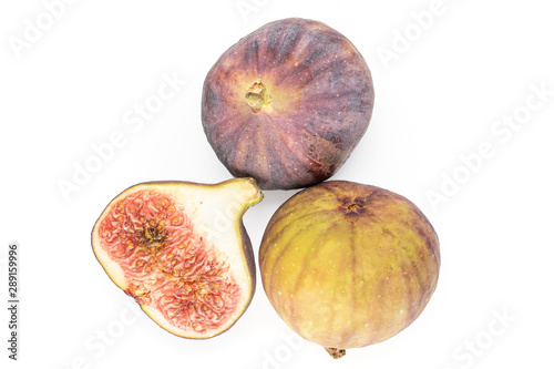 Group of two whole one half of fresh fig fruit flatlay isolated on white background photo