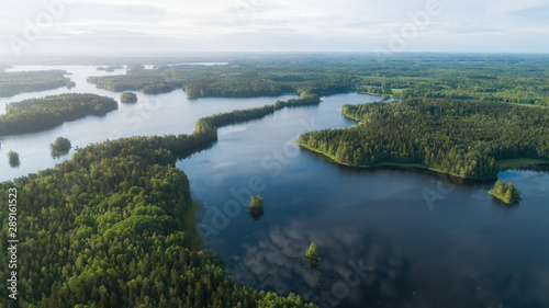  Lake system surrounded with green forest in Finland, aerial landscape. Nature exploration concept. © raland