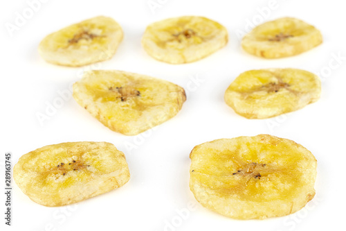 Group of seven slices of sweet yellow dry banana isolated on white background