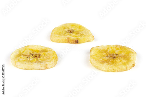 Group of three slices of sweet yellow dry banana isolated on white background