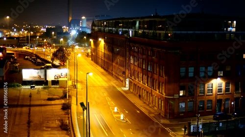 Cars And Traffic Passing Through Nottingham City At Night Time, Dark Street Lit Up With Street Lights And Head Lights photo