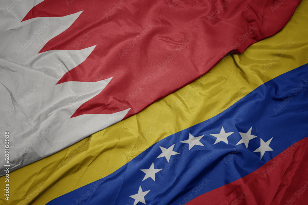 waving colorful flag of venezuela and national flag of bahrain. waving colorful flag of venezuela and national flag of bahrain.