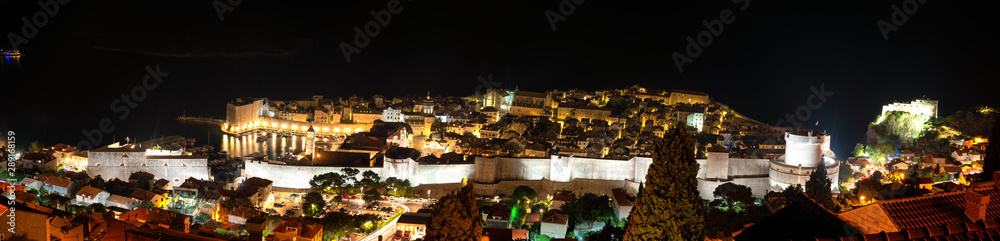 Panoramic Night view from above upon old streets and fortress of Dubrovnik, Croatia.