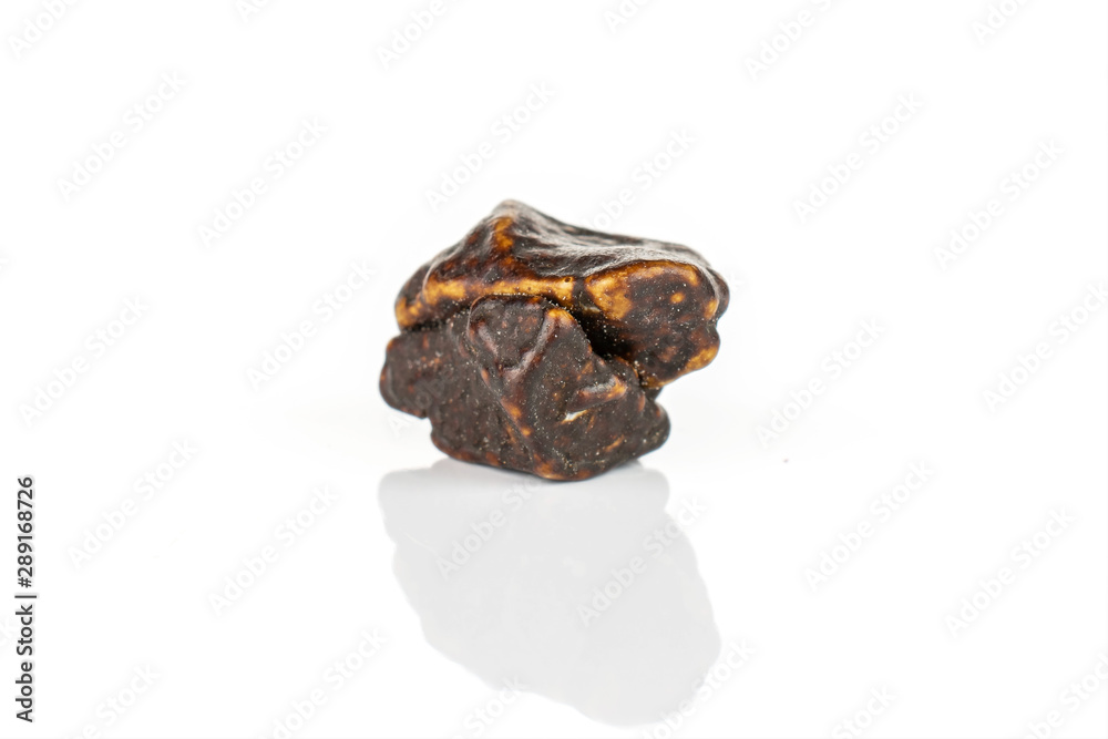 One whole dark brown sweet chocolate stone isolated on white background