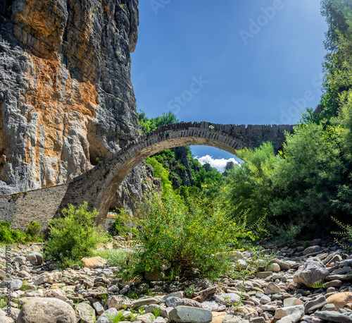 The Noutsou bridge (or Kokkori, as it is also known), a single arch stone bridge, is located in central Zagori, between the villages of Koukouli, Dilofo and Kipoi photo