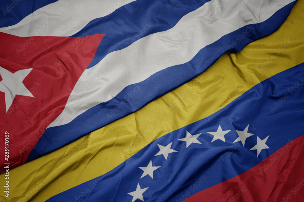 waving colorful flag of venezuela and national flag of cuba. waving colorful flag of venezuela and national flag of cuba.