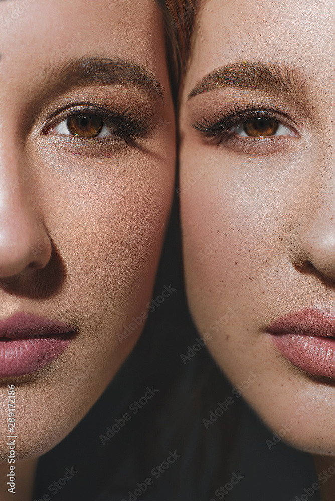 Studio portrait of two red-haired twin girls. Studio portrait of two red-haired twin girls.