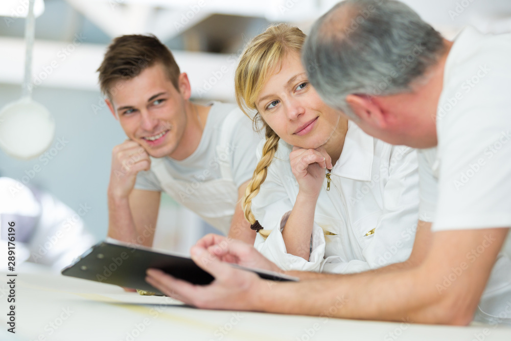 Obraz premium young apprentice painter in professional training