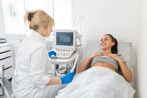 The gynecologist sets up the ultrasound machine and explains to the patient how the study will be performed. Ultrasound of the pelvic organs