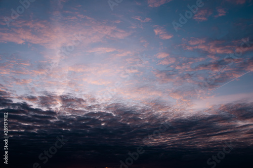 Beautiful blue sky with white clouds and natural colors at sunset