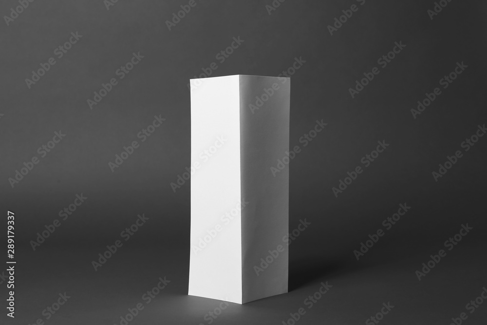 Blank brochure on dark grey background. Mock up for design Blank brochure on dark grey background. Mock up for design