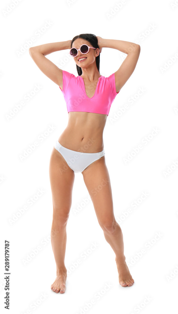 Beautiful young woman in stylish bikini with sunglasses on white background