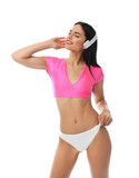 Beautiful young woman in stylish bikini with headphones on white background