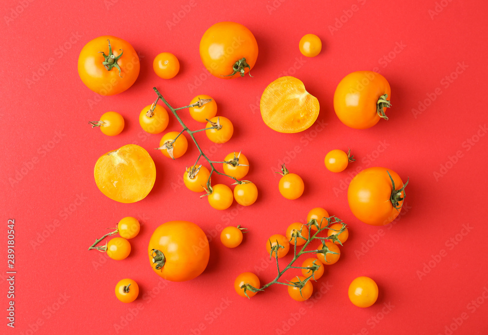 Flat lay composition with fresh ripe tomatoes on red background Flat lay composition with fresh ripe tomatoes on red background