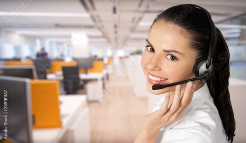 Young woman face with headphones, call center