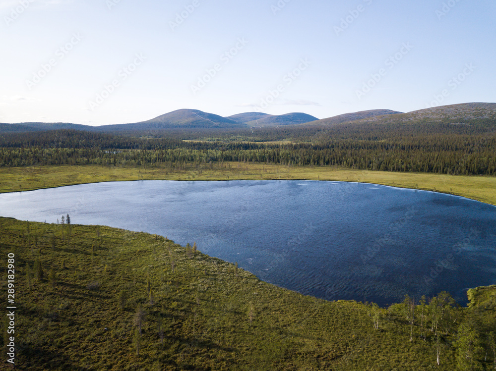 Bog lake with mountains in the background