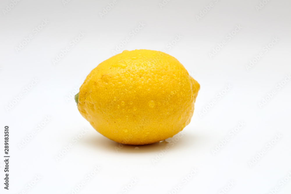 Fresh, ripe, isolated, juicy single lemon on a white background. Studio macro shoot Fresh, ripe, isolated, juicy single lemon on a white background. Studio macro shoot