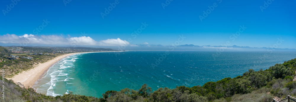 Epic panorama landscape with ocean beach and seaside town