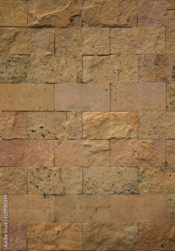Sandstone wall texture with brick pattern background