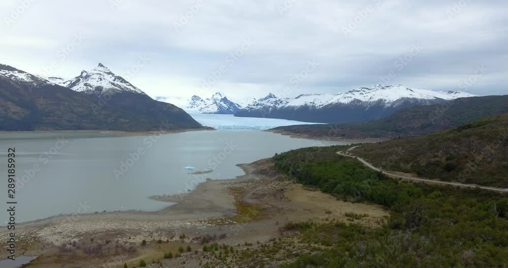 Aerial backwards flight Of Perito Moreno Glacier In Lago Argentino, Patagonia mountains, Argentina. Aerial backwards flight Of Perito Moreno Glacier In Lago Argentino, Patagonia mountains, Argentina.