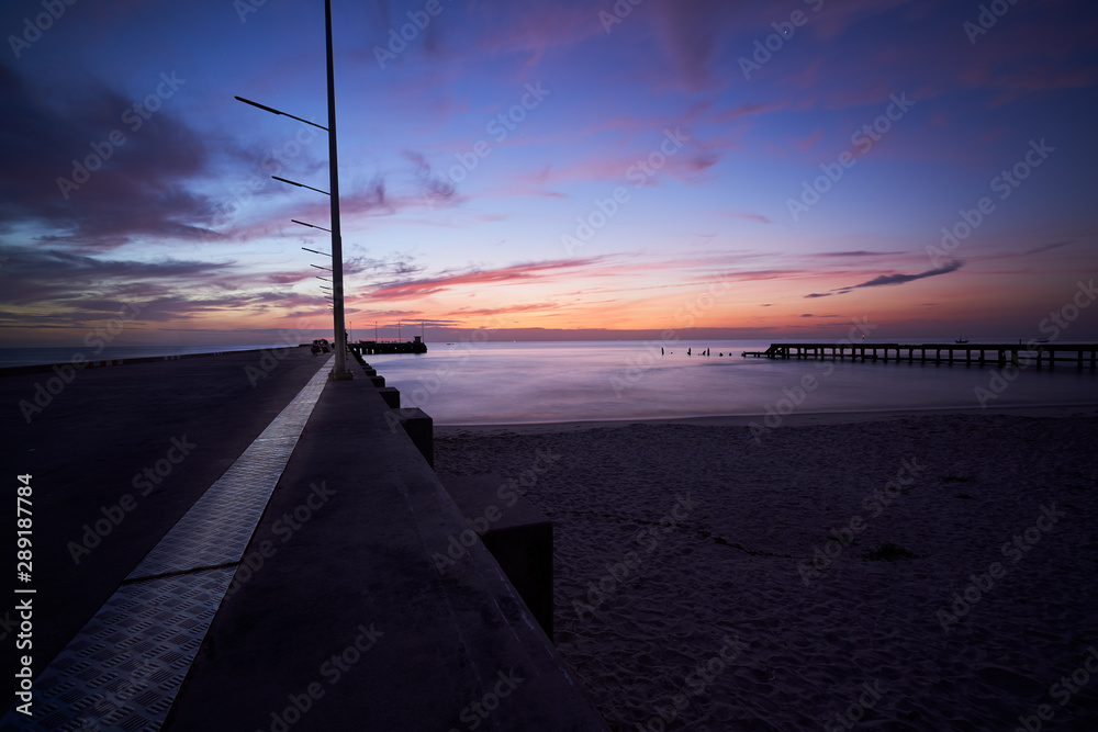 sunrise skyline in twilight time with seascape and sea dock
